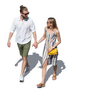 top view of a man and woman walking hand in hand