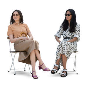 two cut out women sitting casually and smiling