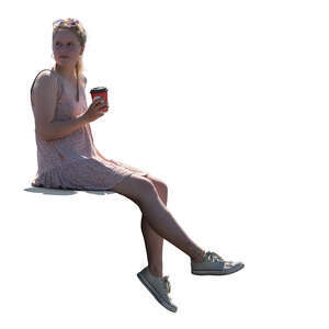 cut out woman sitting on the balustrade and drinking coffee