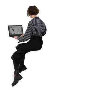 cut out woman sitting on a counter height table with a laptop