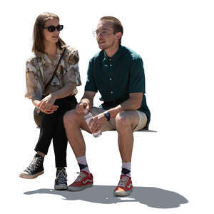cut out backlit man and woman sitting and talking
