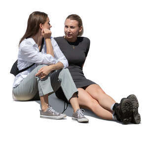 two cut out young women sitting on the sidewalk and talking