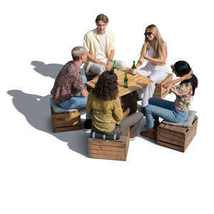 cut out group of young people sitting in an improvised cafe and drinkig beer