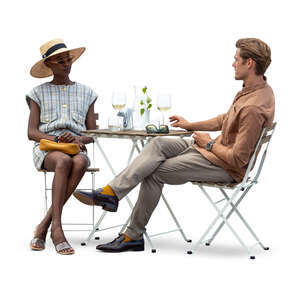 cut out man and woman sitting in a cafe and drinking wine