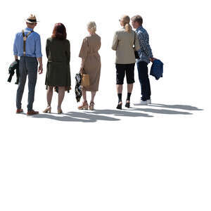 cut out backlit group of people standing and looking at smth