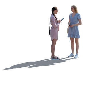 two cut out backlit women standing and talking