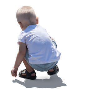 cut out little backlit boy squatting and playing