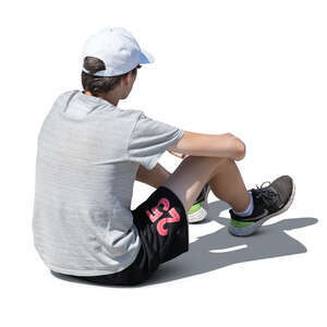 cut out teenage boy sitting on the ground