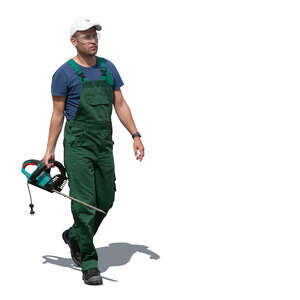 park worker with a hedge cutter walking