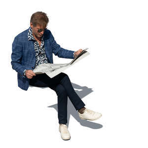 cut out top view of a middle aged man sitting and readning a newspaper