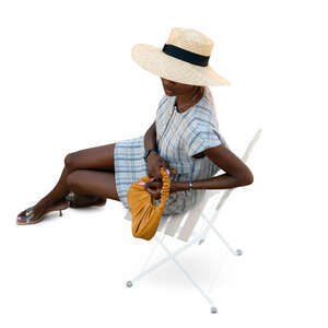 cut out chic woman with a hat sitting seen from above