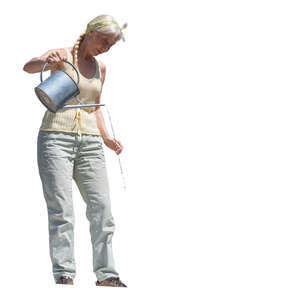 cut out elderly woman standing on a balcony and watering plants