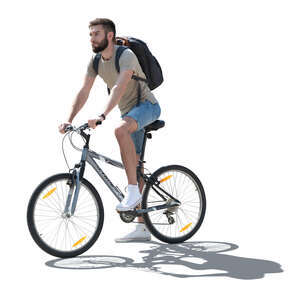 cut out backlit man riding a bike