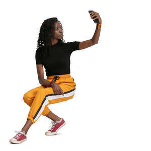 cut out woman sitting and taking a selfie