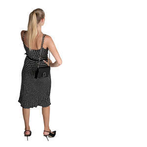 cut out woman in a polka dot dress standing seen from above