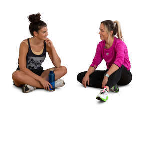 two cut out women sitting and talking after workout