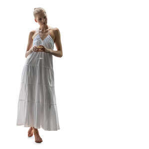 cut out woman in a white long dress standing and drinking wine
