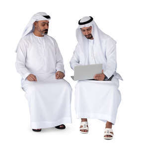 two cut out arab men wearing emirati kandoras sitting and discussing