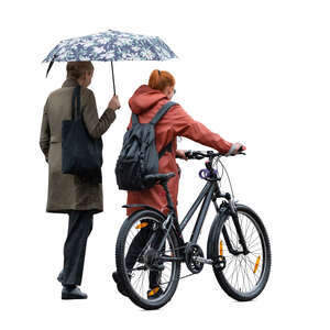 two cut out women with a bike walking in the rain