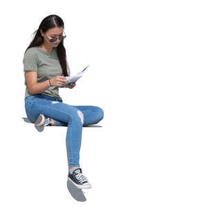 cut out woman sitting outside and reading a book