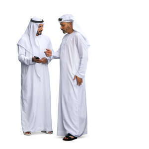 two cut out arab men wearing emirati kandoras standing and talking