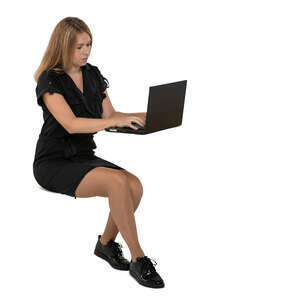 cut out woman sitting at a table with laptop