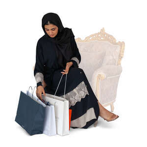 cut out muslim woman with shopping bags sitting
