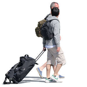 two men with backpacks and suitcases walking down the street