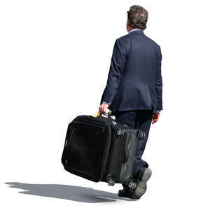 businessman carrying a big suitcase