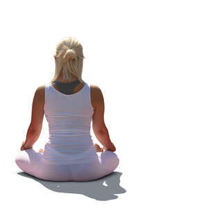 woman doing yoga outside in the sun