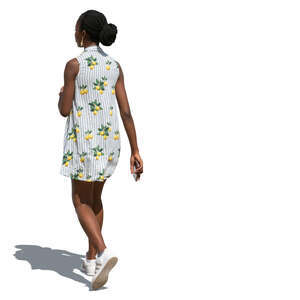 black woman in a light summer dress walking
