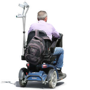 elderly man riding a scootmobile