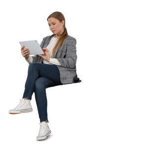 cut out woman sitting and reading from tablet