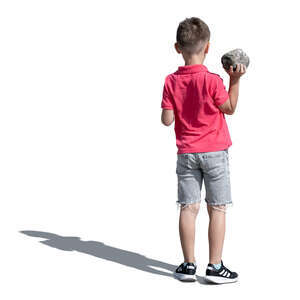 cut out boy standing and holding a rock