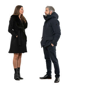 two cut out people in winter coats standing and talking