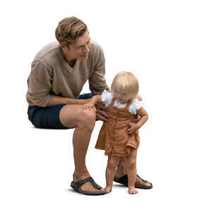 cut out man sitting and holding his baby daughter