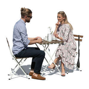 cut out man and woman sitting in a restaurant outside
