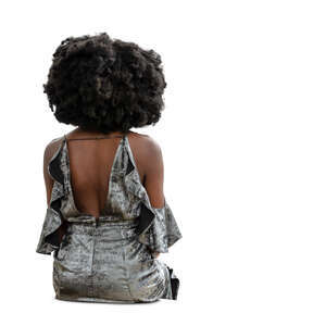cut out woman in a silver dress sitting