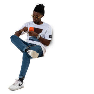 cut out man sitting and attatching headphones to his phone
