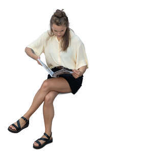 cut out top view of a woman sitting and reading