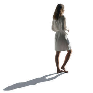 cut out backlit woman in a silky bathrobe standing