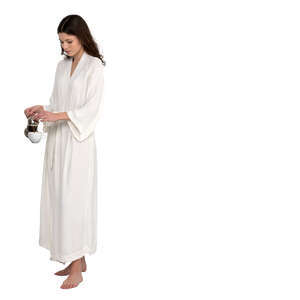 cut out woman in a light white bahthrobe preparing coffee