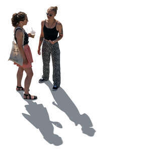 two cut out backlit young women standing seen from above