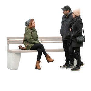 cut out woman sitting and talking to a couple standing next to her