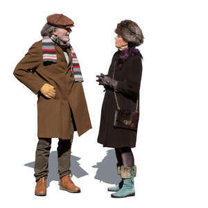 cut out elderly man and woman standing and talking on a sunny winter day