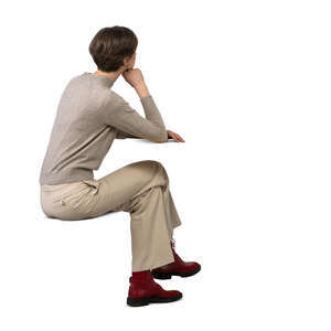 cut out woman sittng and leaning her elbows on a table