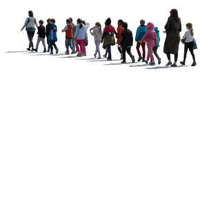 cut out group of backlit schoolkids with their teachers walking