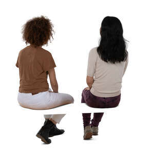 two cut out women sitting seen from back angle