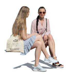 two cut out women sitting and talking