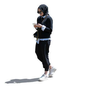 cut out young sidelit muslim woman standing